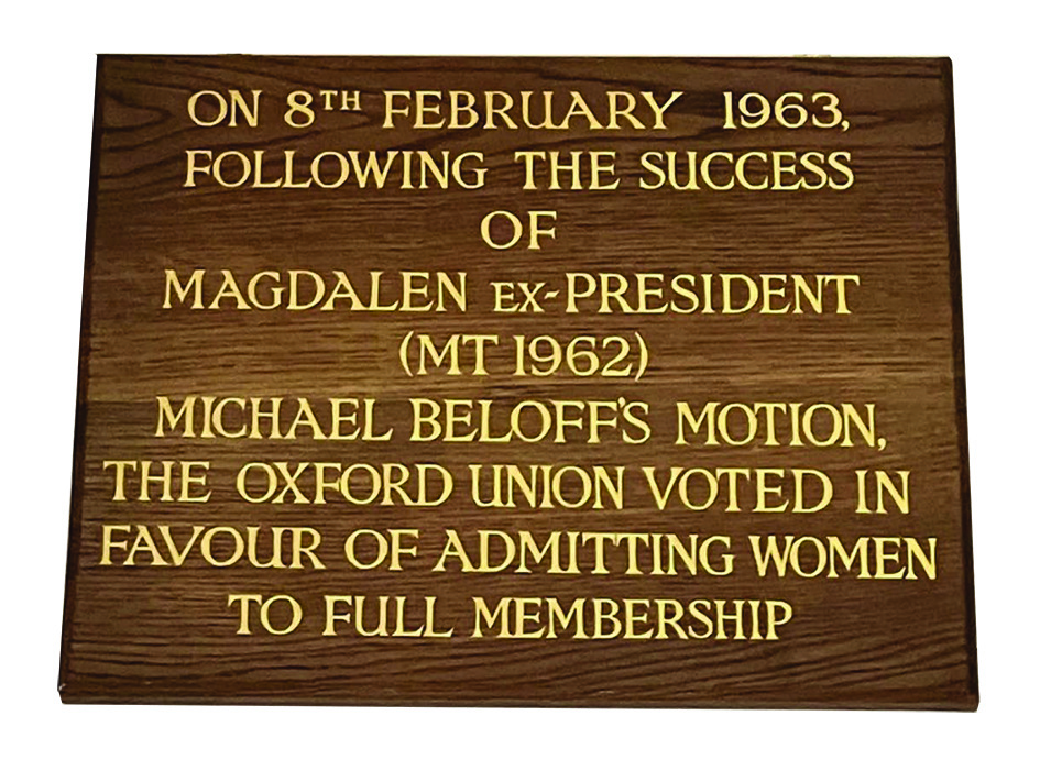 Wooden plaque with gold text commemorating the Oxford Union's 1963 decision to admit women as full members, following a successful motion.