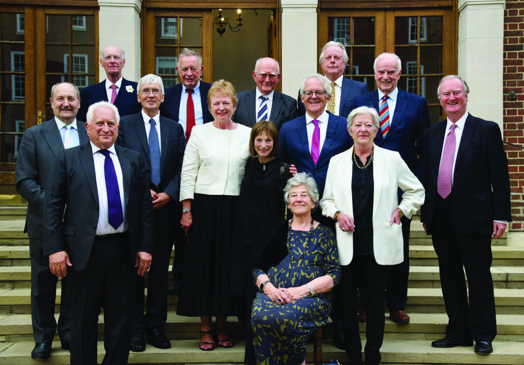 Masters Stephen Richards, Maurice Kay, David Seymour, Christopher Sallon, Kenneth Parker, Wendy Joseph, Charles Miskin, Jacqueline Perry, Michael Butcher, Richard Marks, Richard Macrory, Eleri Rees, Michael Sternberg and Patrick McCahill -Gray's Inn Members, stood in a huddle in front of the Benchers' entrance on the steps. 