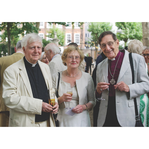 Three people smiling. In the middle a woman with short hair, the Preacher on the right, and the Revd on the left.